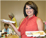 Thessia Everhart-Roberts, helps serve lunch to the Nutrition Site