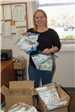Jessica Smith holding up bags during the beat senior hunger event