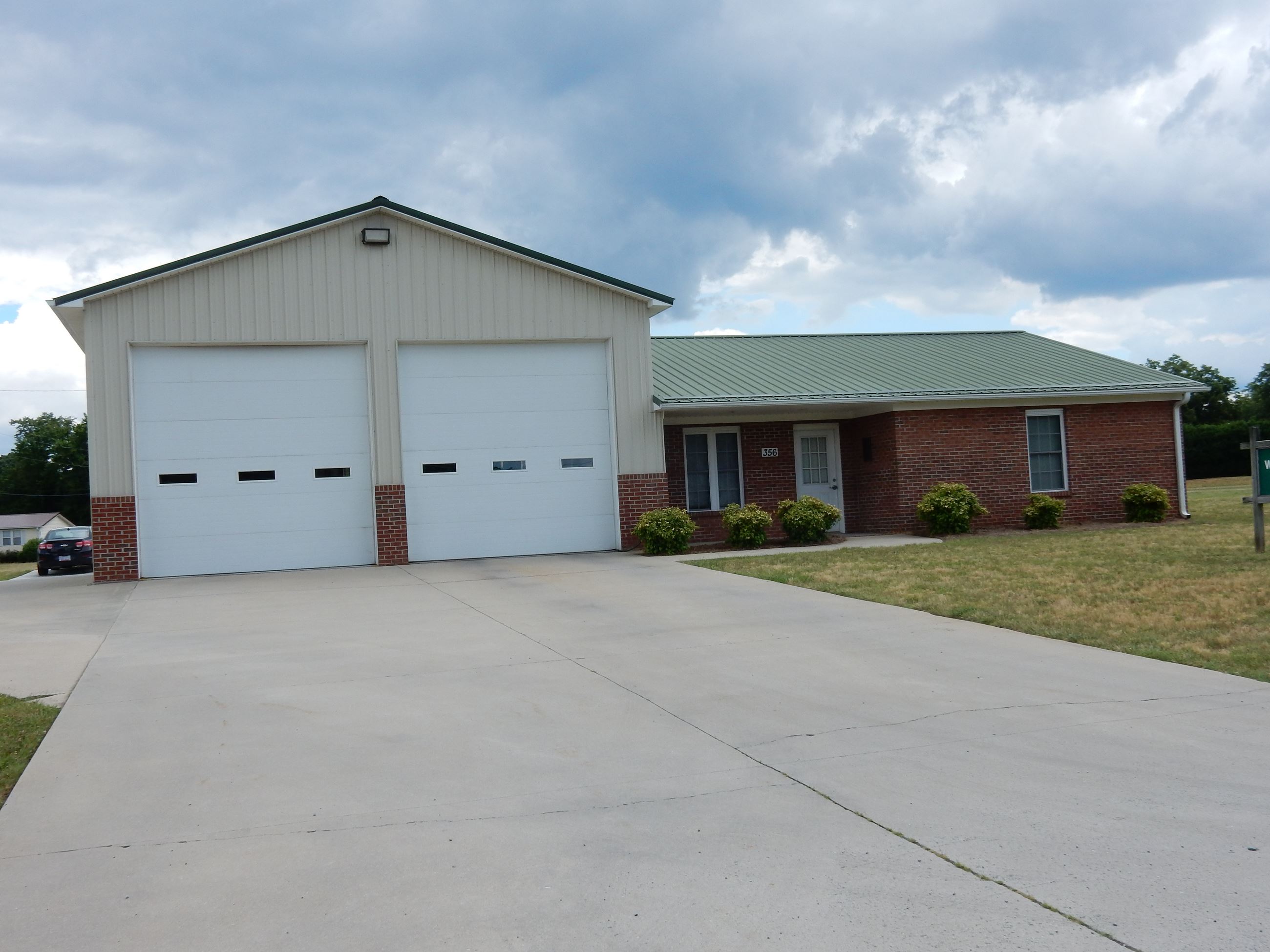 A large white and brick building.
