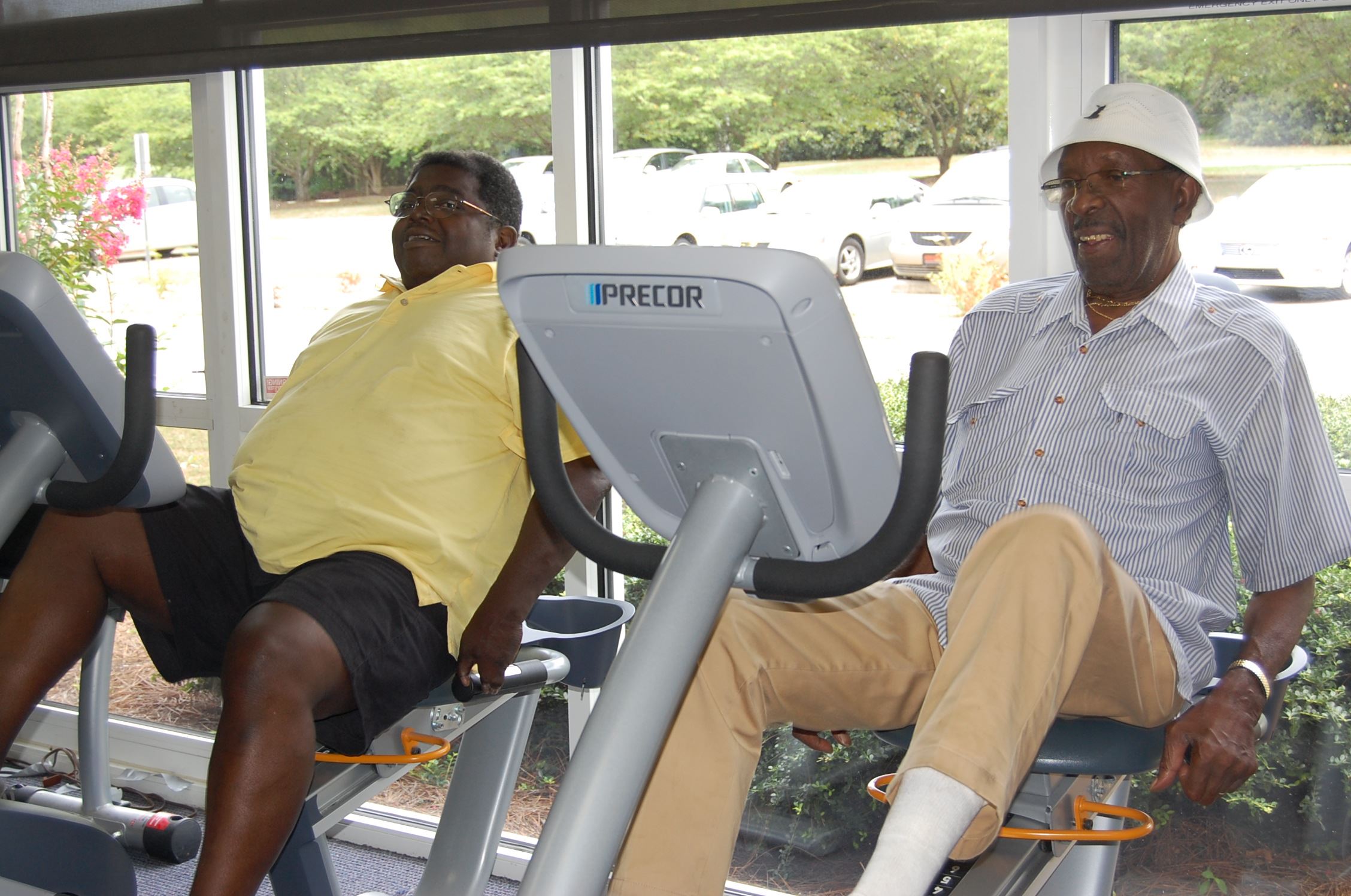 2 seniors on bike machines in the Fitness Room