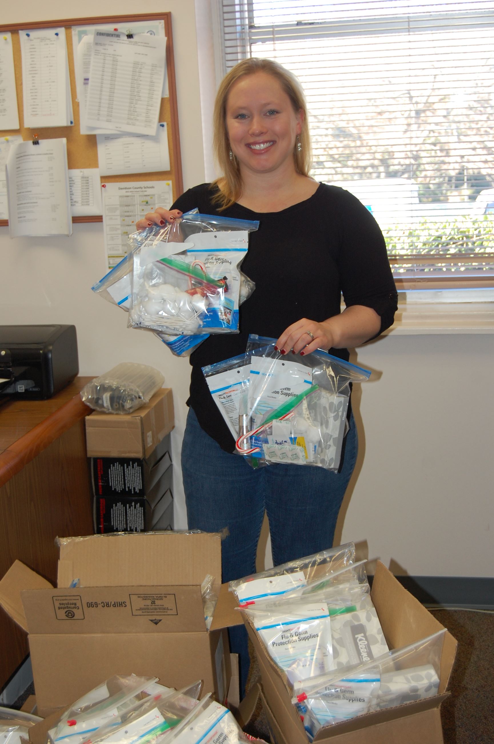 Jessica Smith holding up bags during the beat senior hunger event