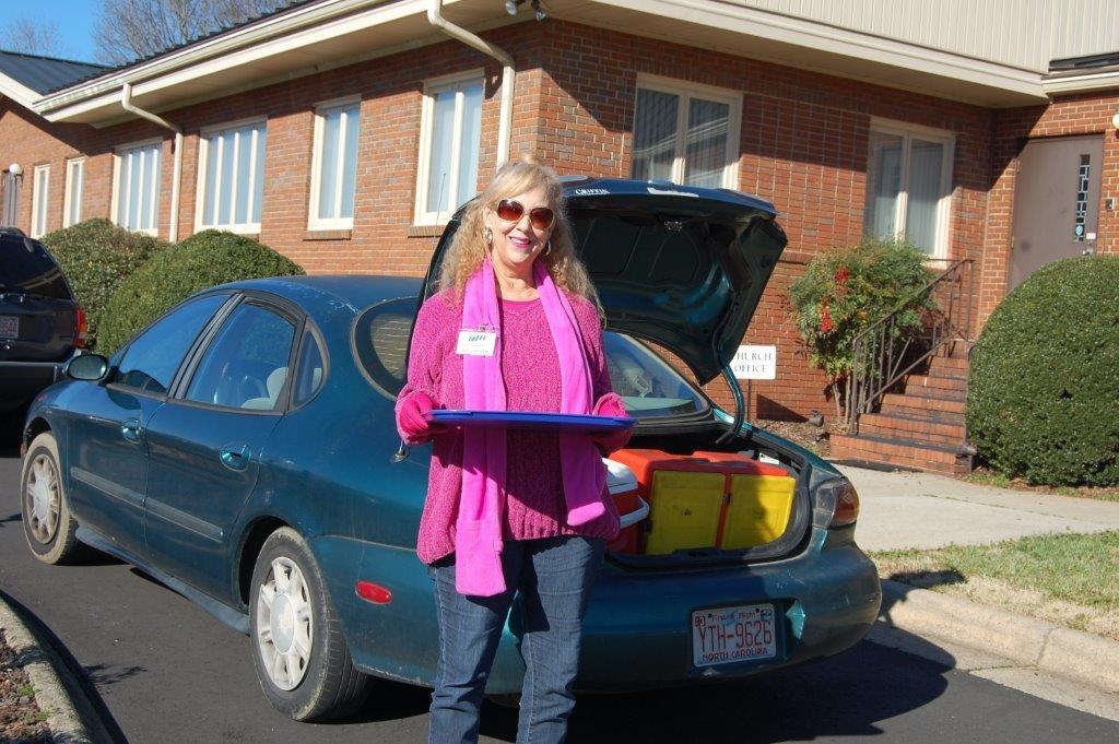 Person delivering a meal for Meals on Wheels