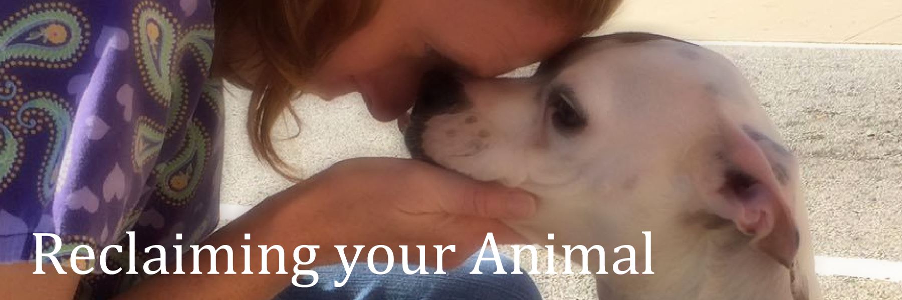 Woman Holding a White Dog